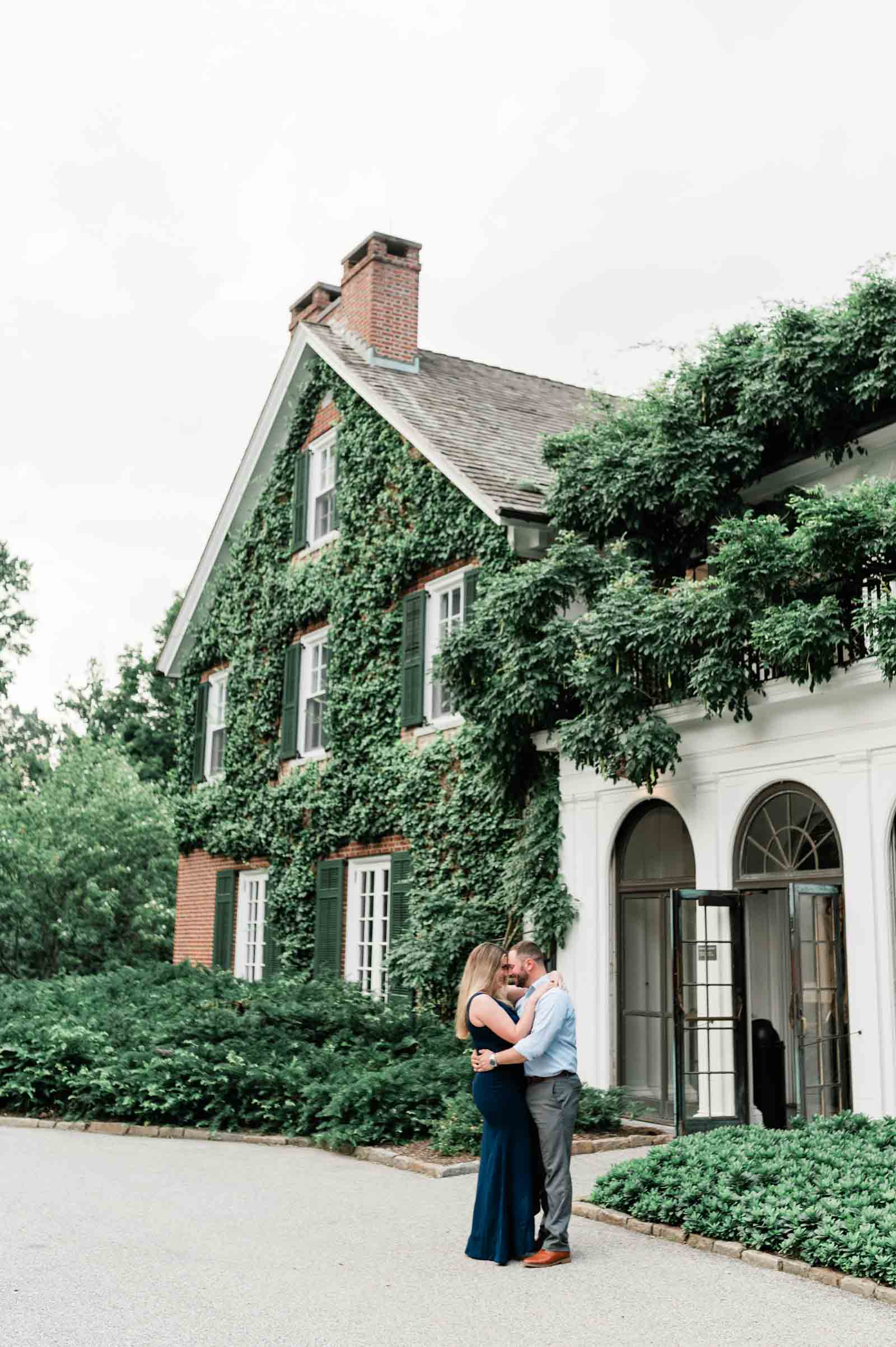 Charming couple surrounded by nature's beauty during their engagement photo session in Philadelphia.