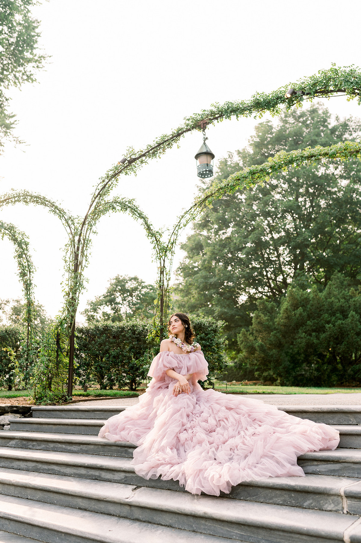 In the couture gown, Karla embodies the essence of a high-fashion model, her confident and striking pose commanding attention amid the beauty of Longwood Gardens.