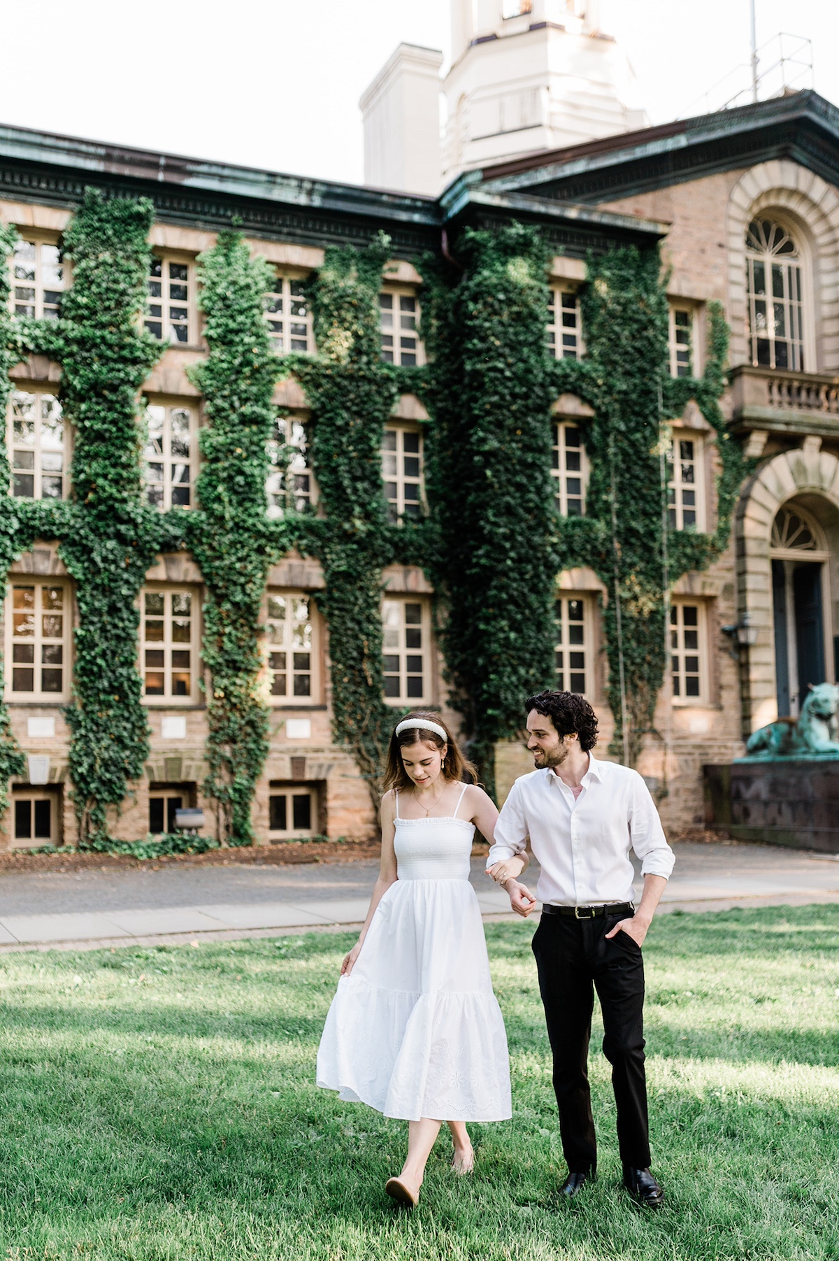 The historic Nassau Hall at Princeton University, a stunning backdrop for the engaged couple's intimate moments.