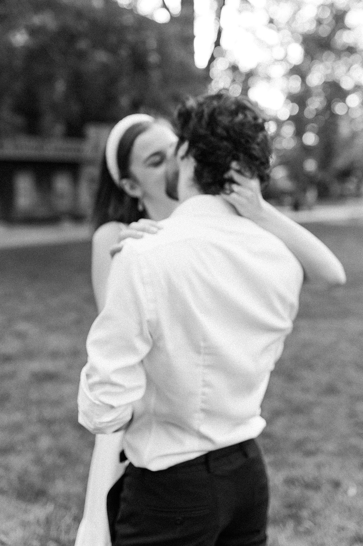 Intimate embrace framed by Princeton University's picturesque surroundings.
