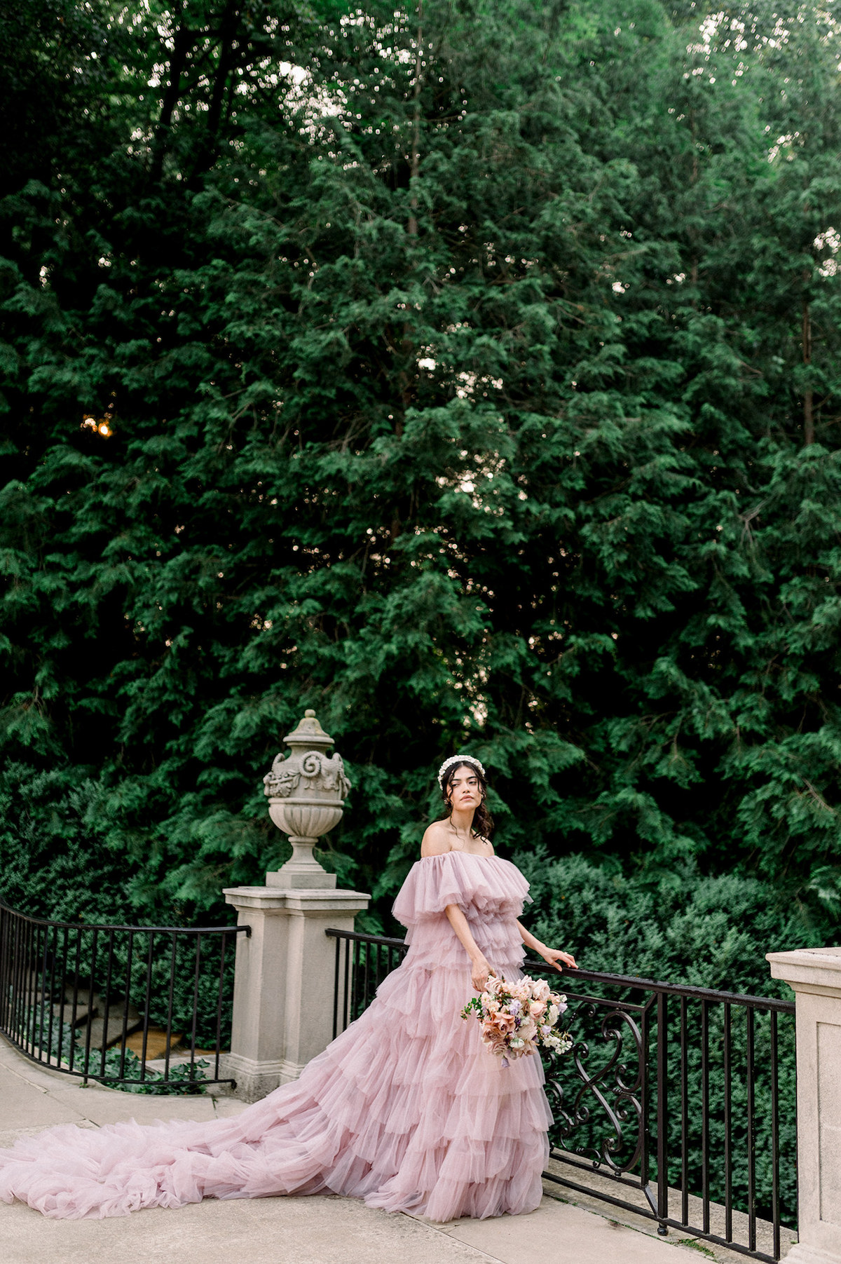 A captivating moment as Karla, dressed in the exquisite couture gown, showcases her modeling prowess with a high-fashion editorial pose at Longwood Gardens.