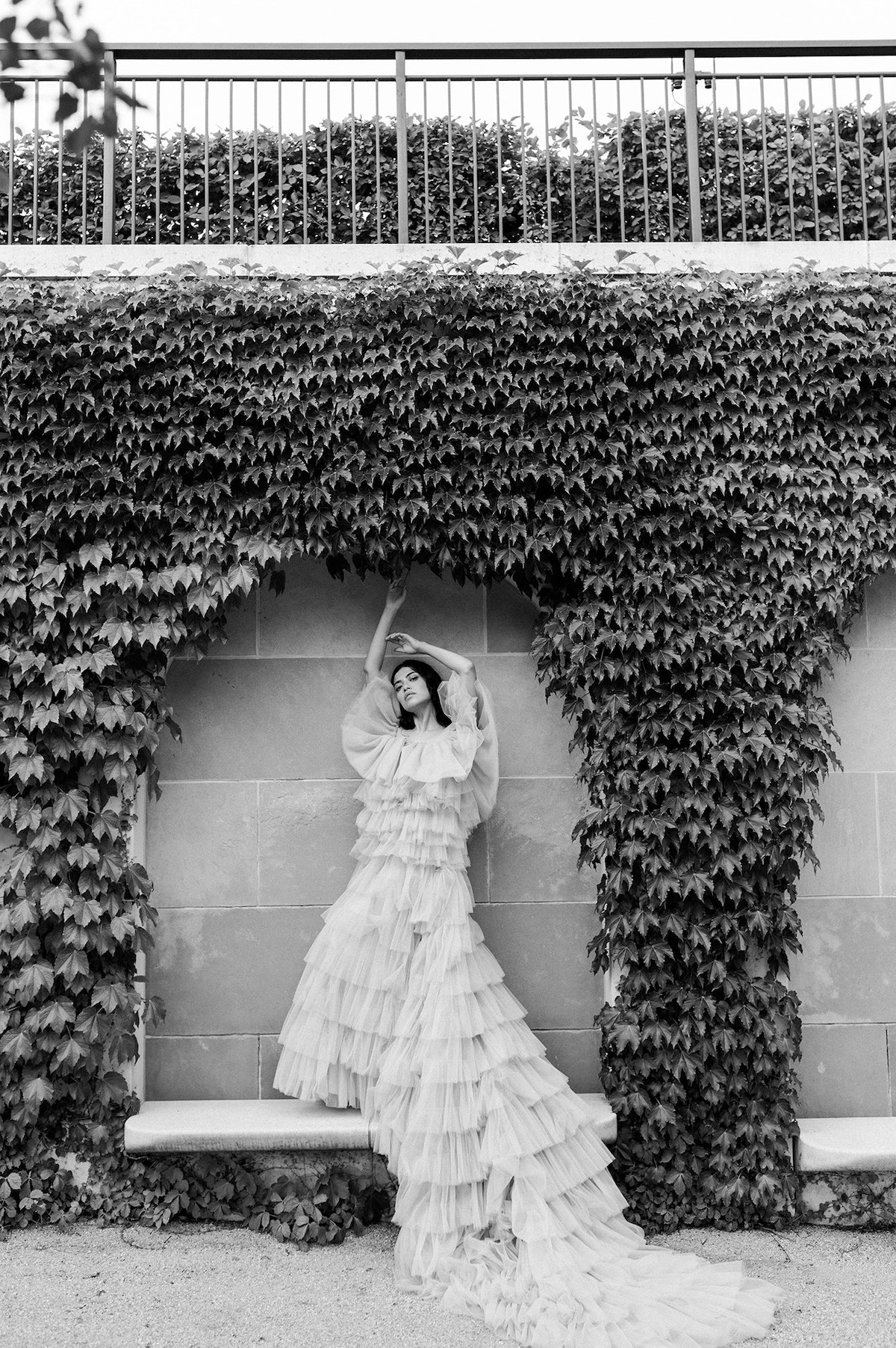 In this high fashion black and white shot, the bride embodies strength and softness, creating a captivating editorial moment.