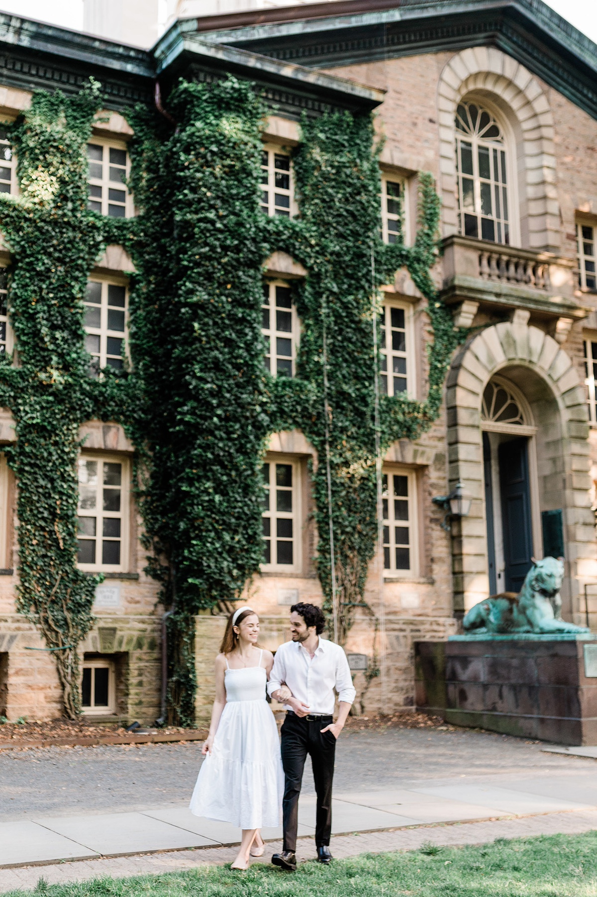 The historic Nassau Hall at Princeton University, a stunning backdrop for the engaged couple's intimate moments.