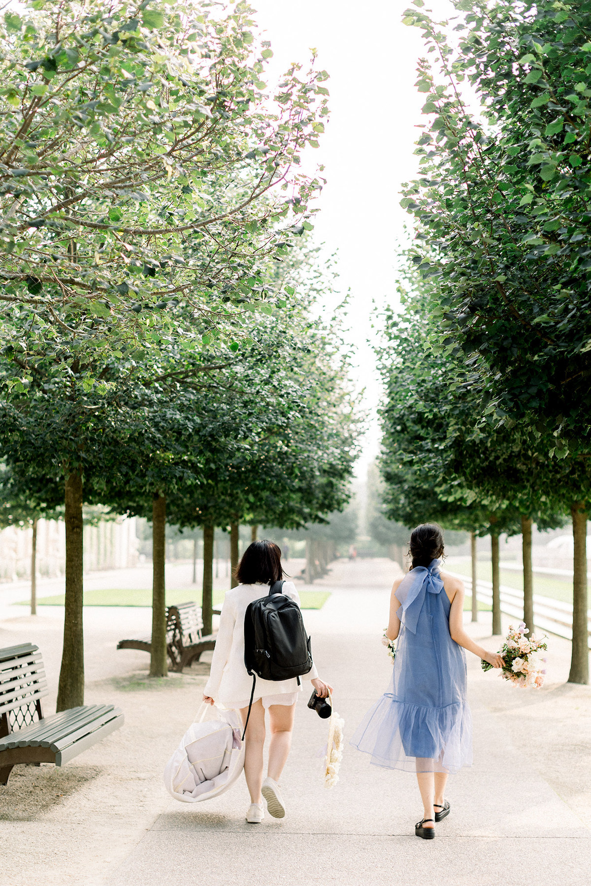 Behind-the-scenes moment as April Raymond and Karla collaborate to bring the editorial concept to life amid the lush backdrop of Longwood Gardens.