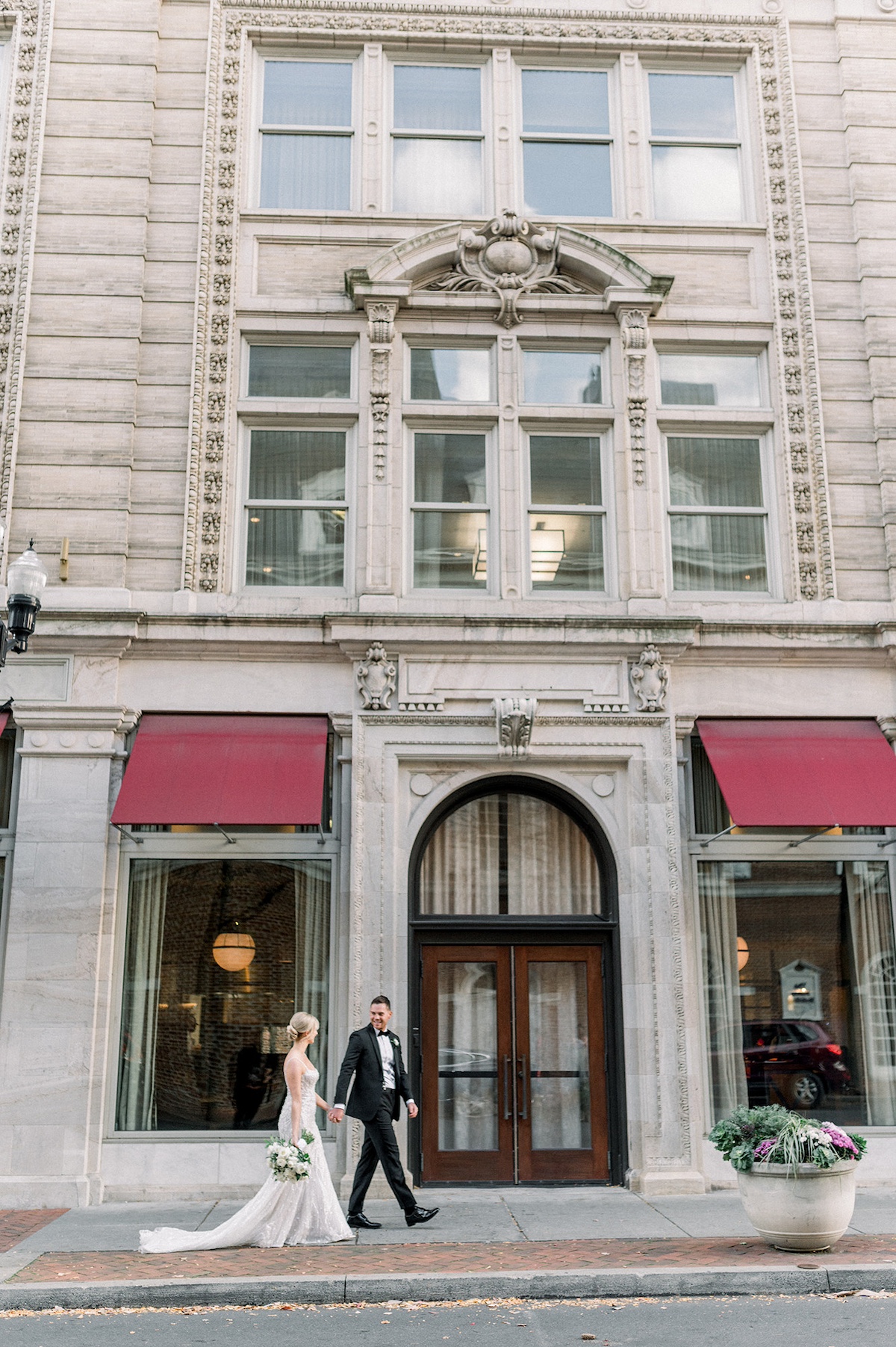 Affectionate and classic, the bride and groom's portrait against Lancaster City's architectural beauty is a testament to their high-end love story.