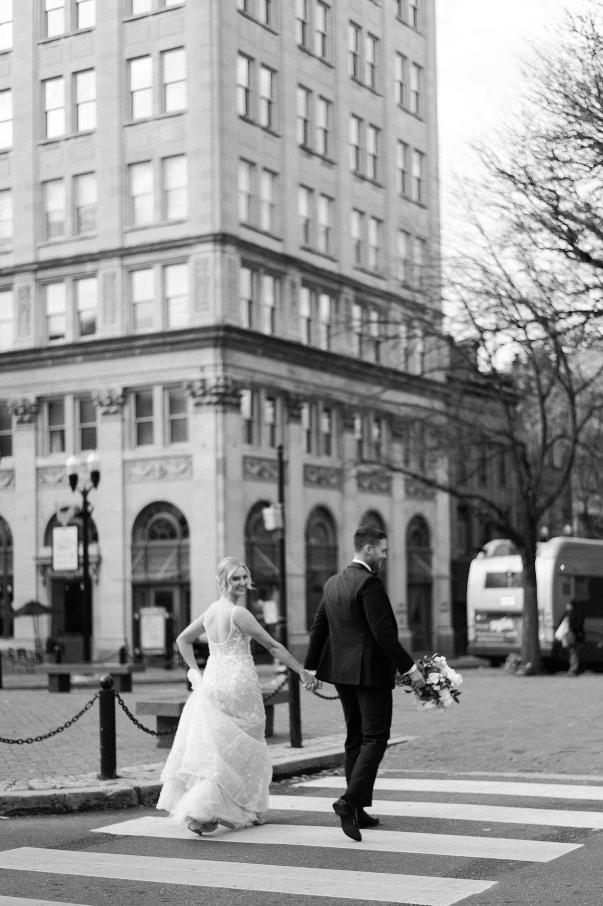 Continuation of the love journey in Lancaster City, where the bride and groom share a high-end moment of togetherness during a leisurely walk.