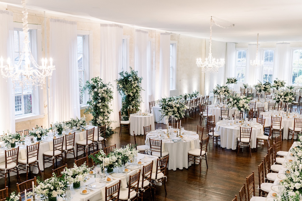 Editorial overview of the luxurious reception hall, portraying a high-end setting with intricate decor details and ambient lighting.