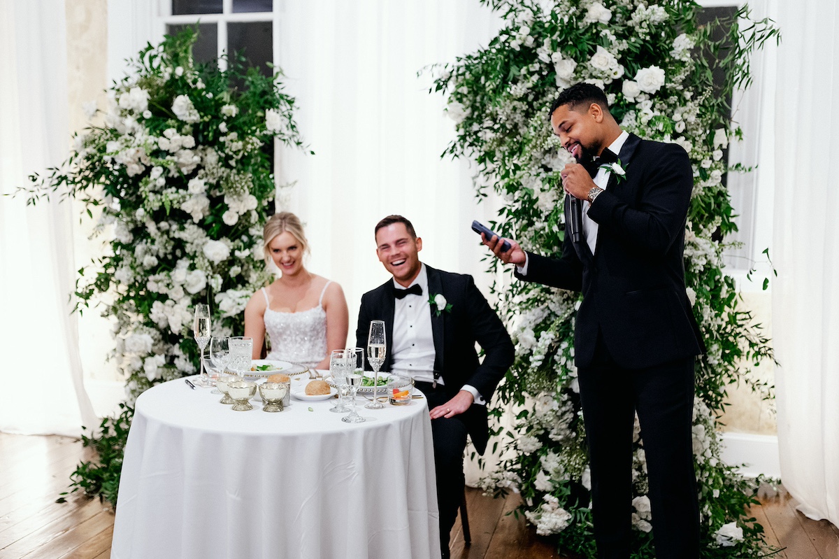 A heartfelt toast to love and happiness, a moment shared by family and friends at Kelly and Adam's joyous reception.