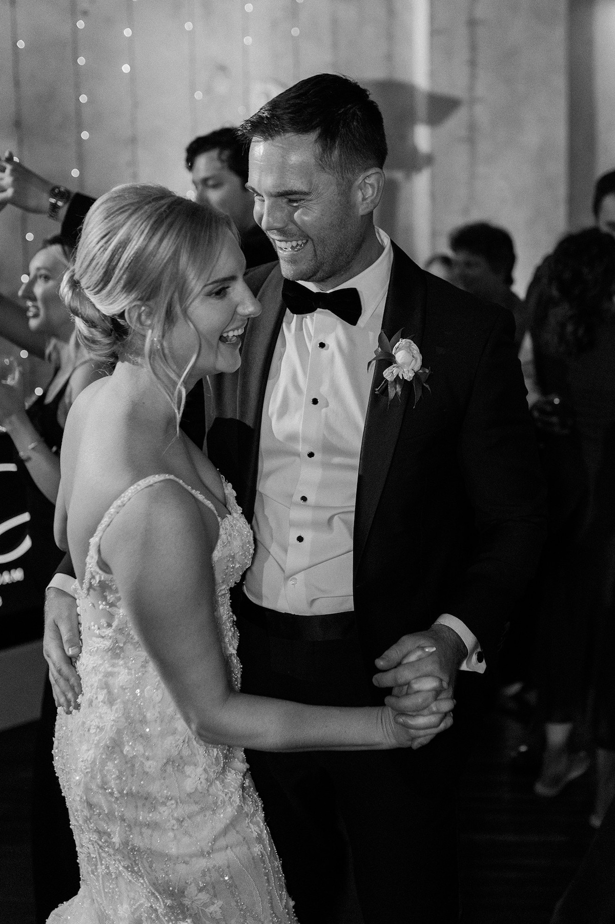 Elegance on the dance floor under the stars, where Kelly and Adam share their first dance as a married couple in a magical setting.