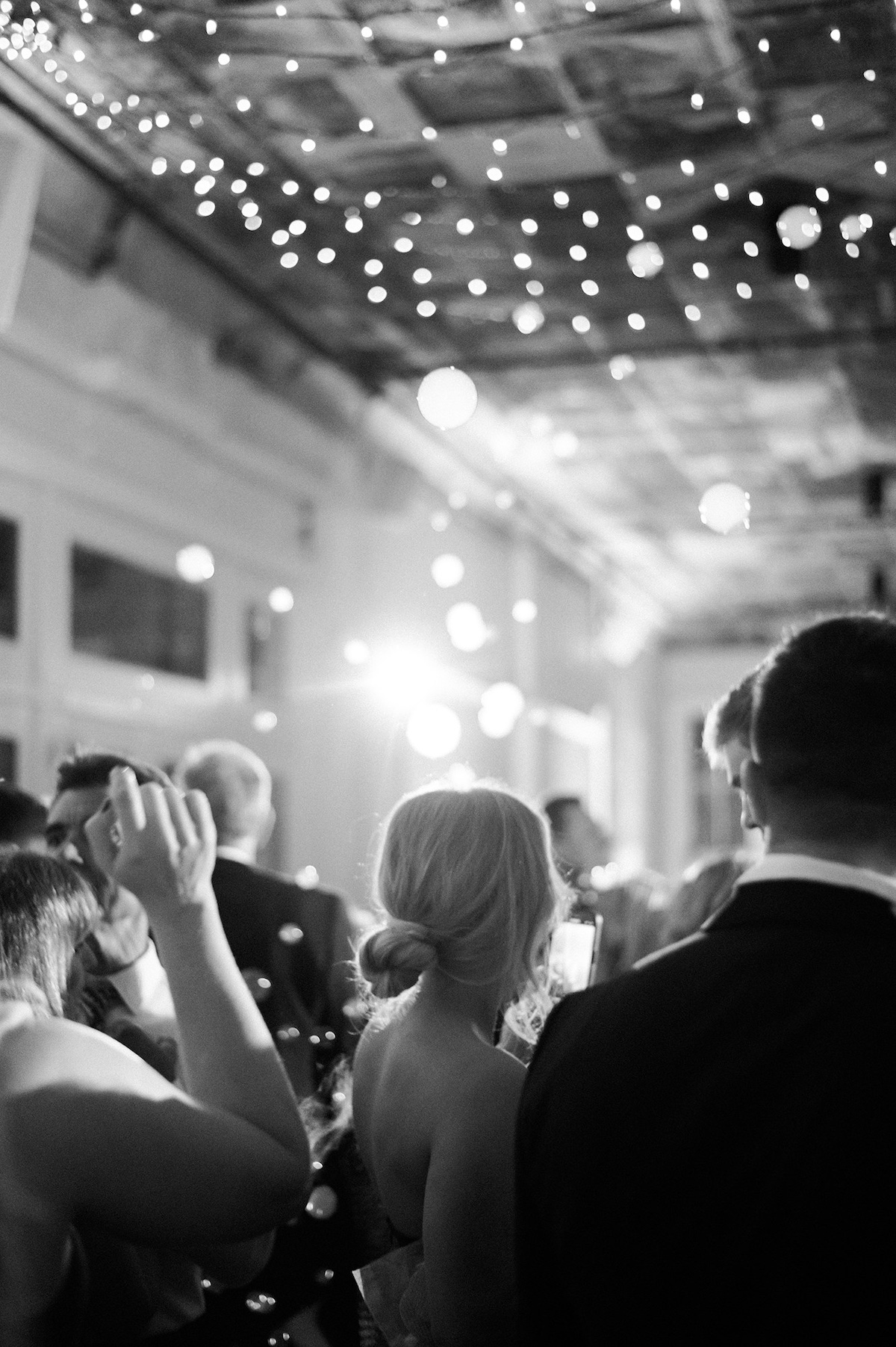 Elegance in motion as guests dance the night away, creating a vibrant and celebratory atmosphere at Kelly and Adam's wedding reception.