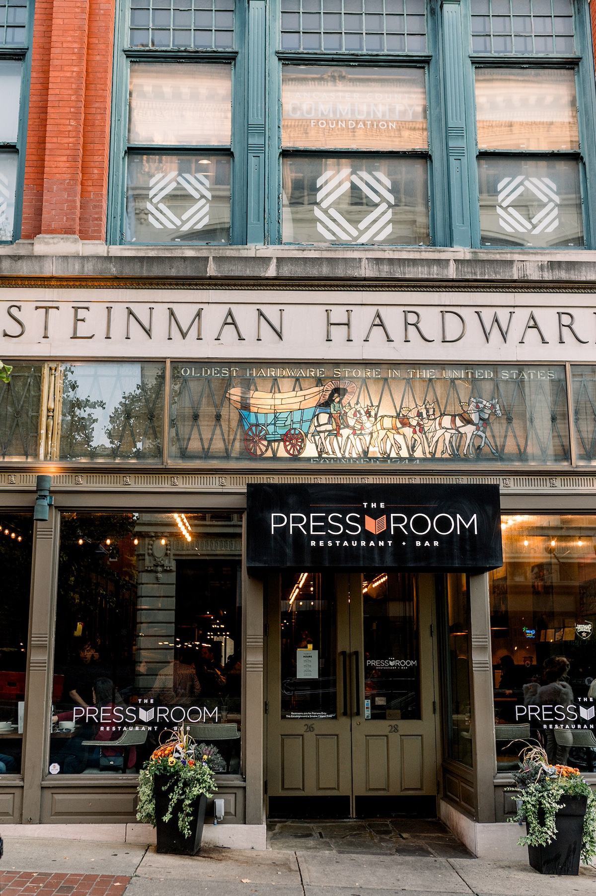 The historic charm of the Pressroom Restaurant sets the perfect backdrop for a lively welcome party.