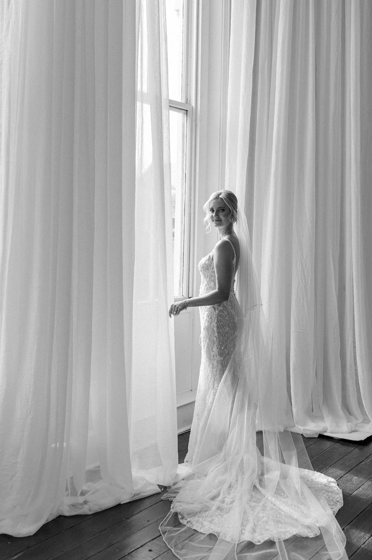 An editorial monochrome portrait of the bride, emphasizing elegance and creating a timeless visual narrative