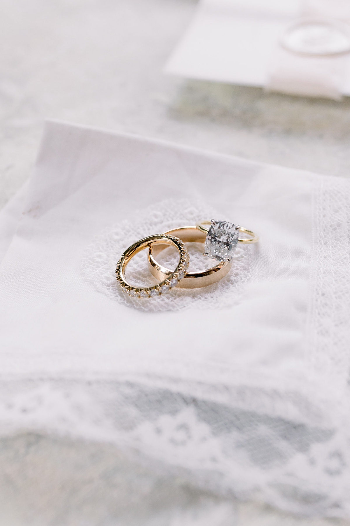 A sophisticated flatlay featuring the couple's wedding rings, arranged with timeless elegance.