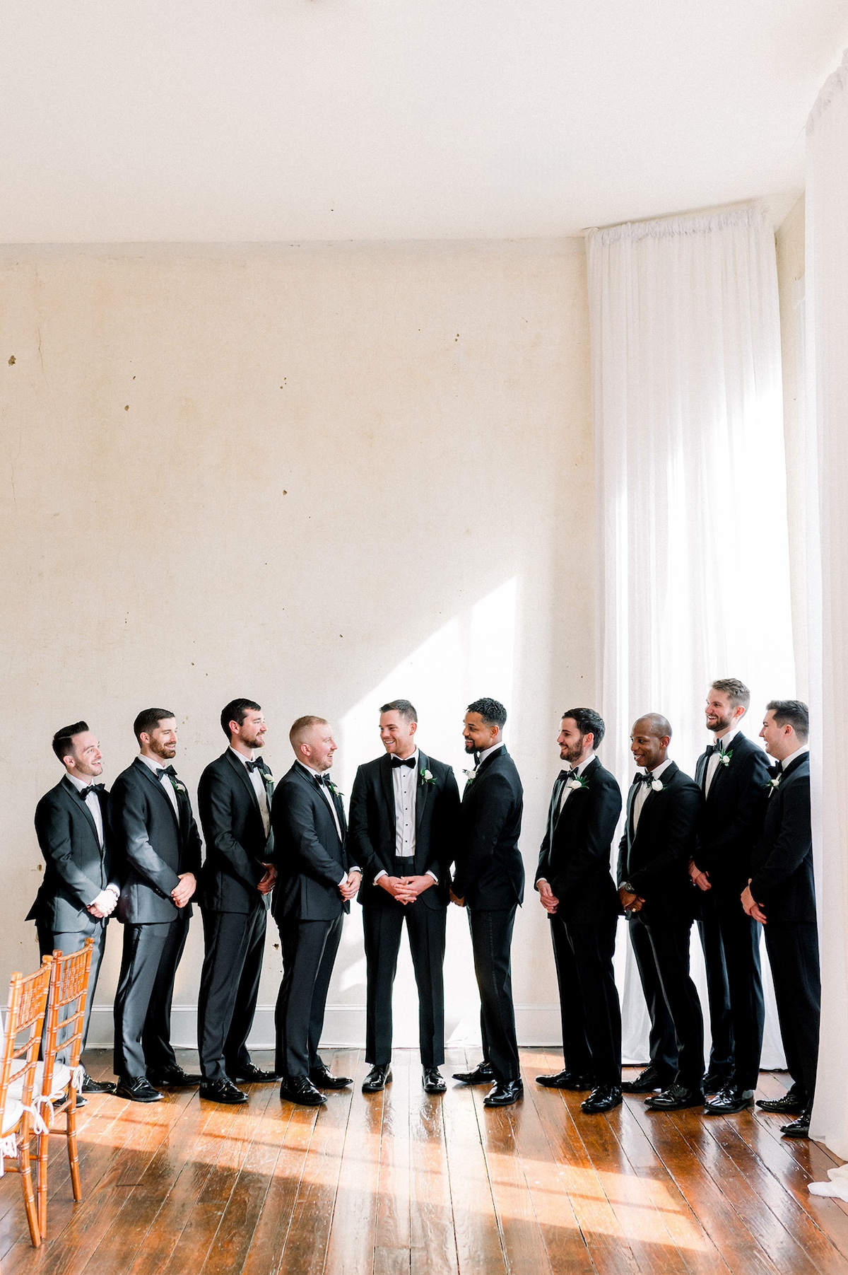 Group portrait of groomsmen in editorial style, embodying a collective sense of high-end fashion and sophistication.