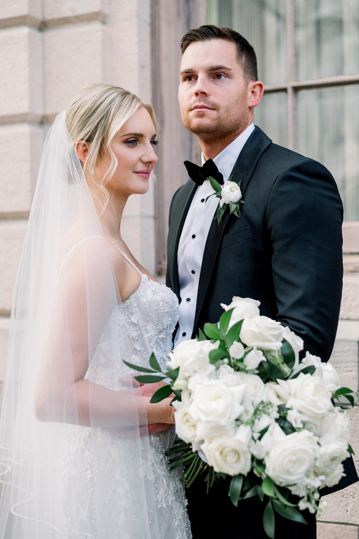 Classic editorial portrait in Lancaster City, the bride and groom embrace on its historic streets, exuding timeless romance and high-end charm.