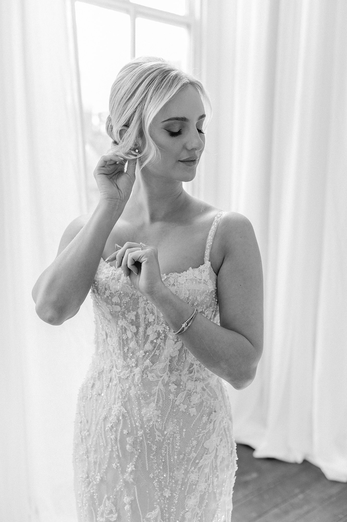 An editorial approach to the bride's dressing ritual, unveiling layers of opulence in preparation for the grand moment.